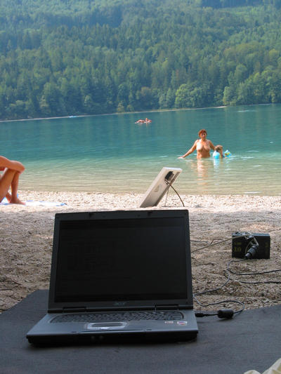 IT work place independent with solar power
Here on the beach on a sunny day, a small 20 Watt photovoltaic with a small 12V 72 Ah buffer battery powers the working place of an independent internet promotion consultant.